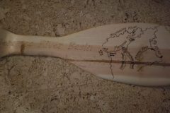 Laser engraved wall hanging shaped like a canoe paddle